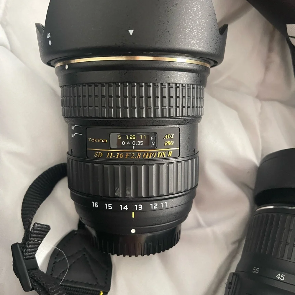Nikon D3200 with multiple lenses, tons of attachments and comes with accessories
